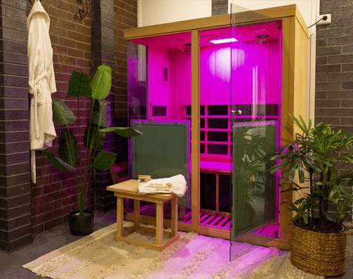 Evolve 30 - 3 person infrared sauna with Pink Light on